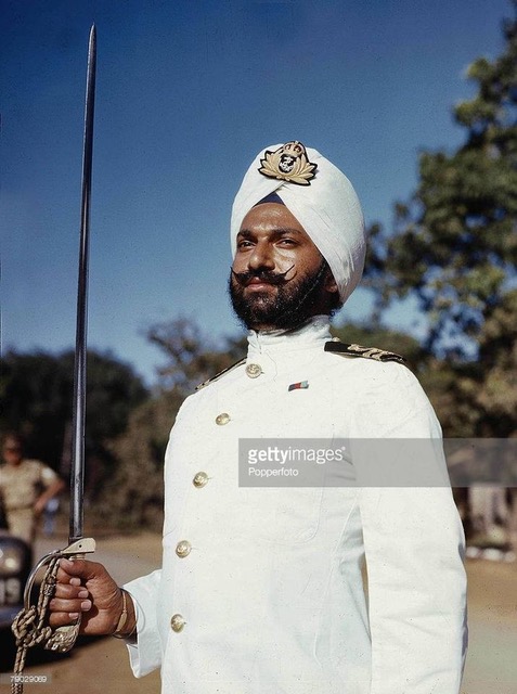 Lt PS Mahindroo in tropical rig and turban, on parade.
